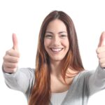 Beautiful Woman Smiling With Both Thumbs Up wisconsin injured worker