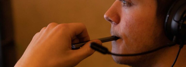 A picture of a teen using JUUL