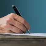 businessman-or-lawyer-signing-a-document-WA5LN2W (1)