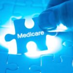 Medicare puzzle piece being fit into a puzzle_s