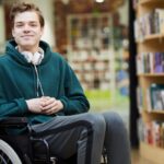Young man sitting in a wheel chair_s