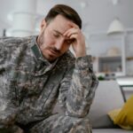 Soldier looking sick on a couch_s