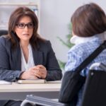 Attorney with an injured person in an office_s