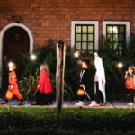 Trick-or-treaters on a sidewalk_s