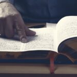 Man looking through a dictionary_s