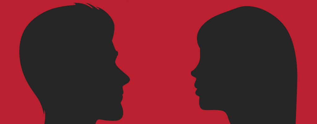 Silhouette of a man and a woman on a red background