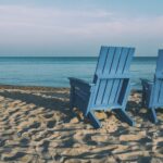 Blue chairs on a beach_u