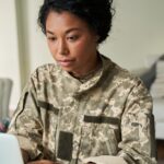 soldier looking at a computer_s