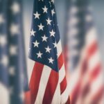 American flags in a line with a blurred background_t_s