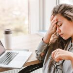 Woman struggling with something at her computer_s