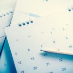 Calendars in a stack with a pencil_s