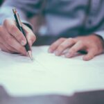 Man trying to fill out paperwork_u