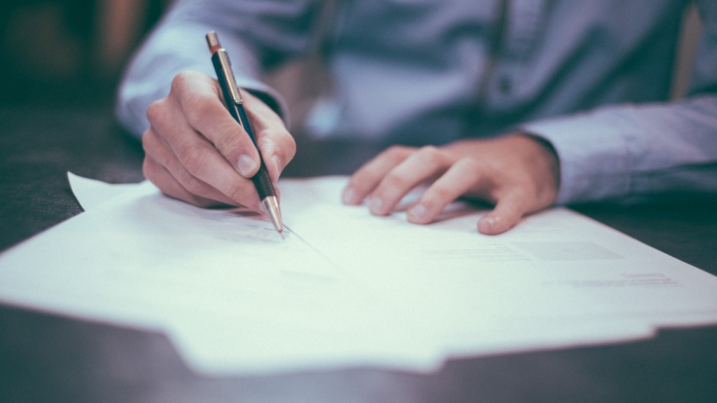 Man trying to fill out paperwork