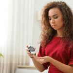 Young woman checking her blood sugar_s