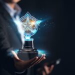 person holding a trophy with a star on it_s