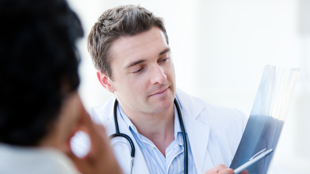 Doctor pointing at an x-ray