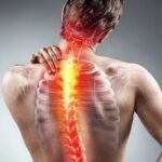 Man holding hurt back_s