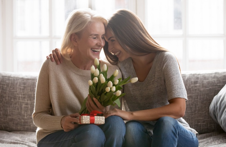 Woman with elderly mom on Mother's Day