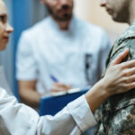 Close-up,Of,A,Soldier,Being,Consoled,By,Healthcare,Workers,At
