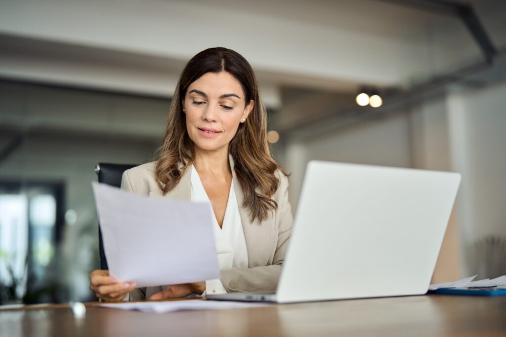 woman looking at tax papers