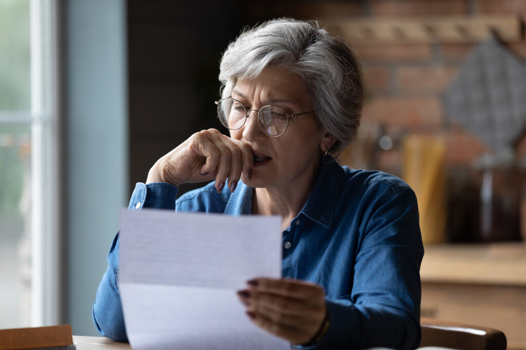 lady looking at a letter