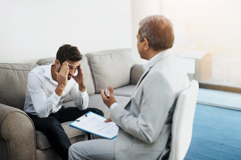 stressed man with doctor