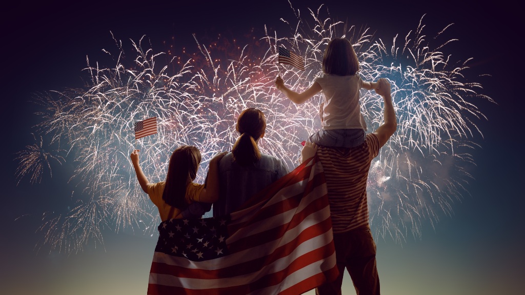 happy family against the backdrop of fireworks