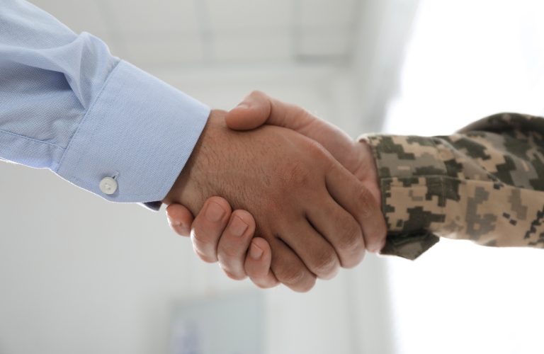 veteran shakes hands with lawyer
