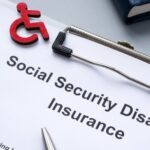 Clipboard with Social Security Disability Insurance policy_s