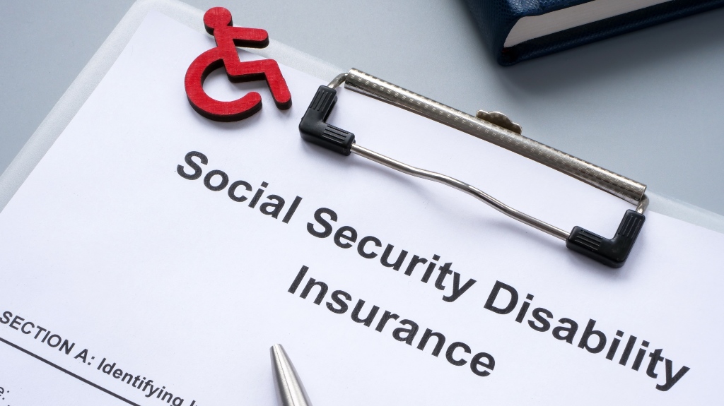 Clipboard with Social Security Disability Insurance policy