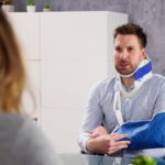 Injured man consulting with lawyer_s