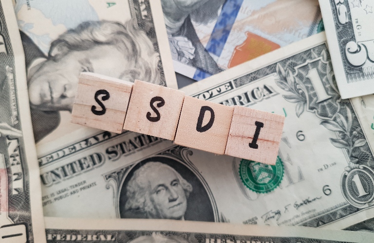 SSDI on dollar background