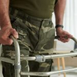 veteran in uniform using walk helper_s