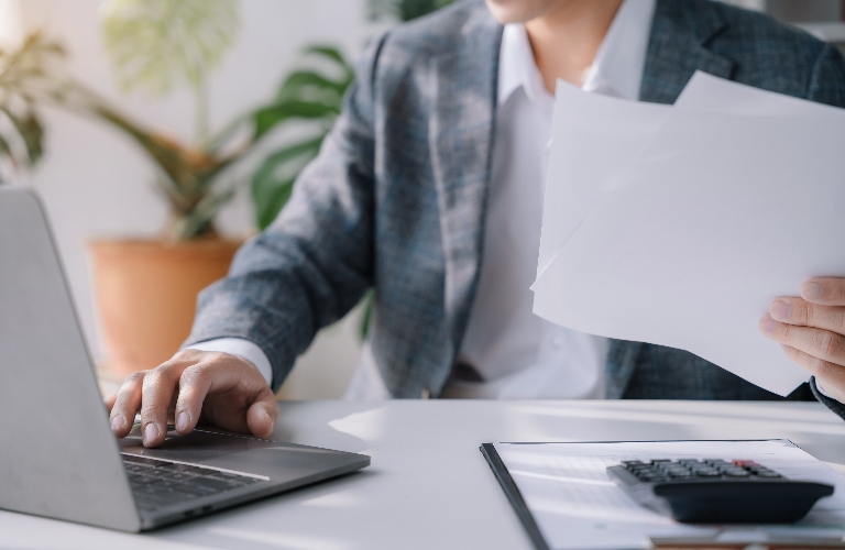Lawyer is working at office with laptop
