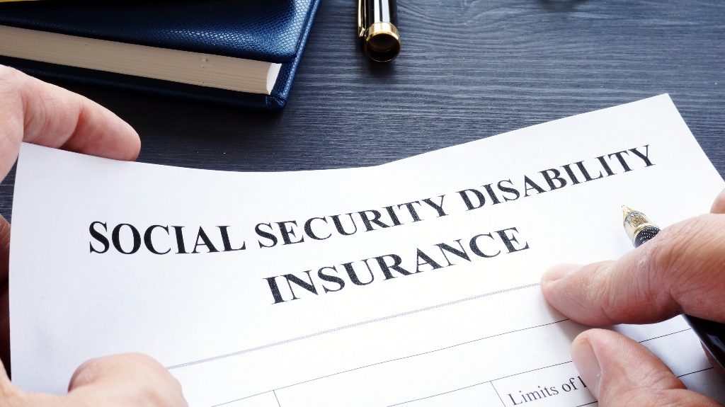 Man is holding Social Security Disability Insurance