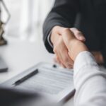 Lawyer shaking hands with a client_s