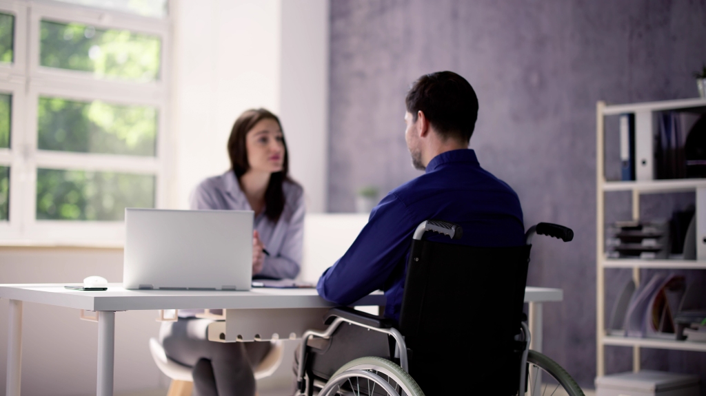 Injured worker is talking to the manager in the office
